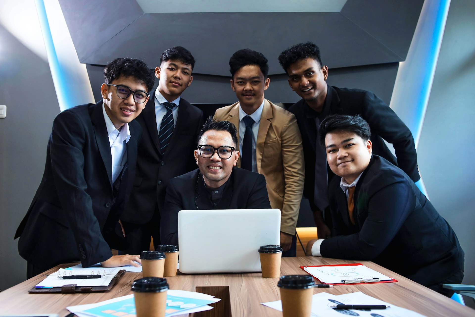 Multinational team discussing Thai work permit process – HR and legal coordination